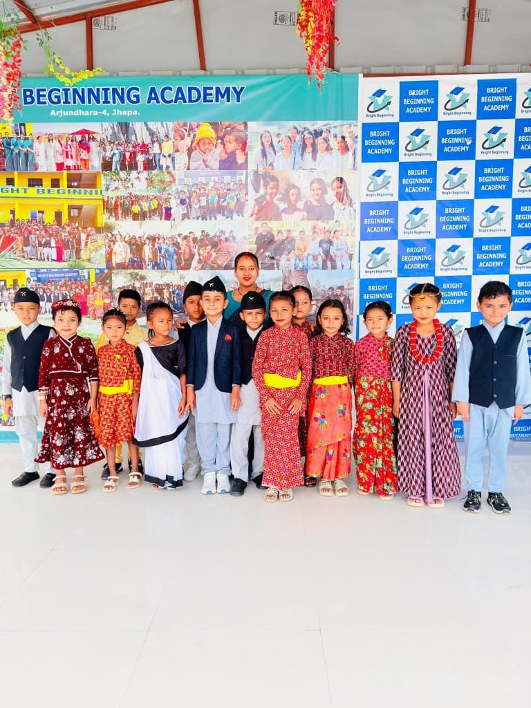 Students and a teacher in traditional and formal dress at a school event