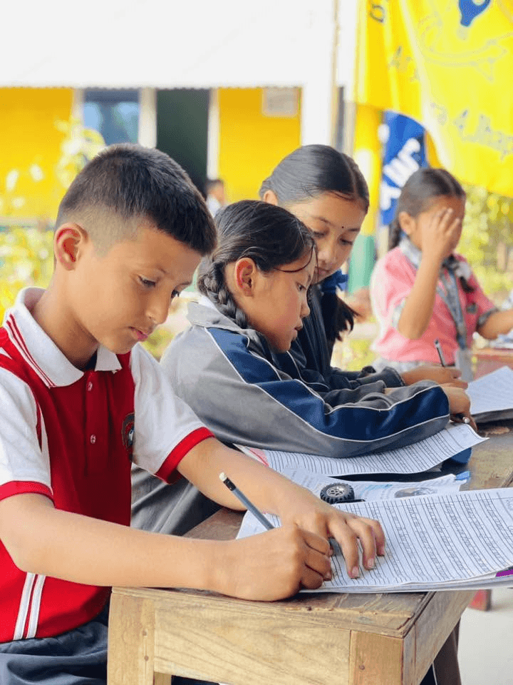 Students studying and writing outdoors